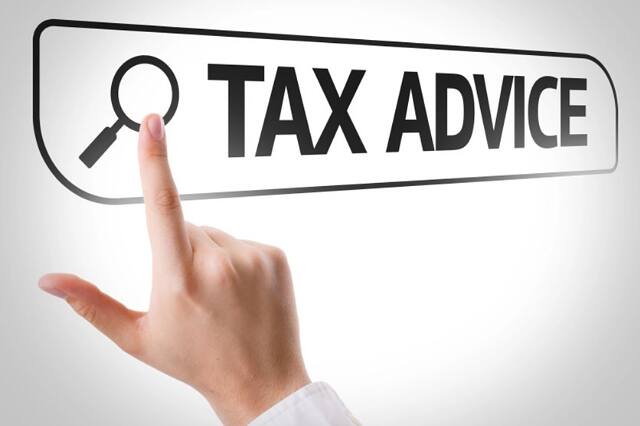 Finger pressing a Tax Advice search button